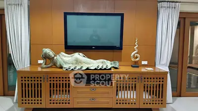 Elegant living room with stylish wooden cabinet and modern decor