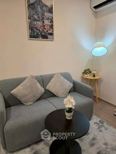 Cozy living room with modern decor and plush seating