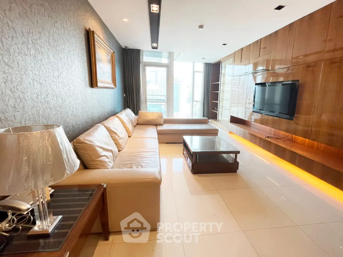 Luxurious modern living room with sleek design and city view, featuring elegant furniture and ambient lighting.