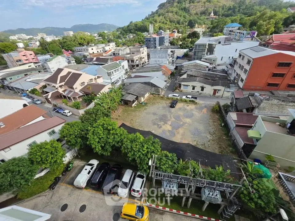 Aerial view of a residential neighborhood with diverse architecture and lush greenery.