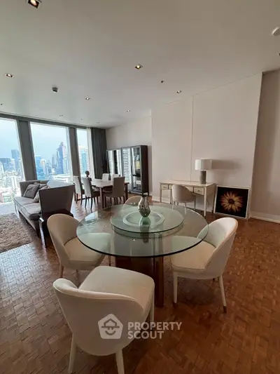 Luxurious living room with city view, elegant furniture, and parquet flooring in modern apartment.