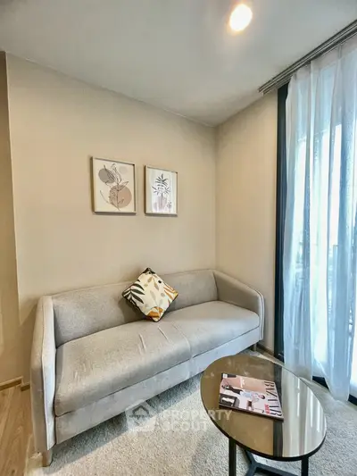 Cozy living room with modern sofa and stylish decor, perfect for relaxation.