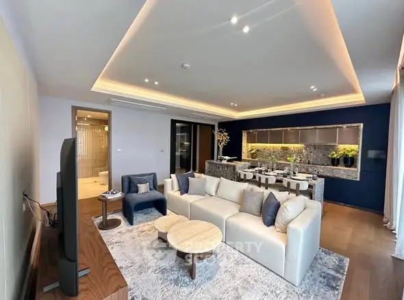 Luxurious open-plan living room with modern kitchen and elegant decor
