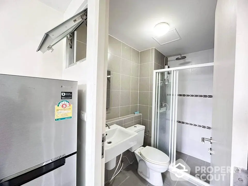 Modern bathroom with shower and sleek fixtures in contemporary apartment