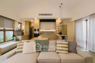 Spacious modern living room with open kitchen and stylish decor