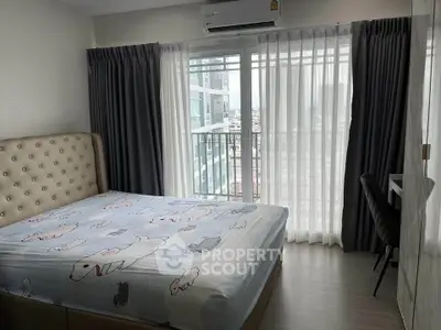 Cozy bedroom with large window and modern decor in urban apartment