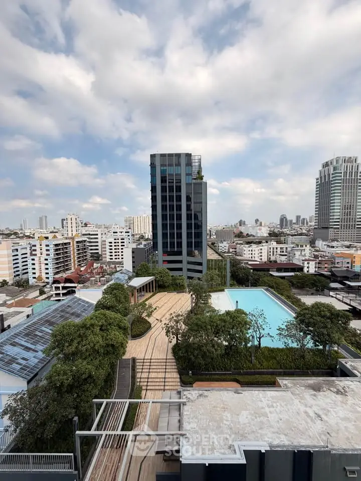 Stunning rooftop view with pool and city skyline, perfect for urban living.