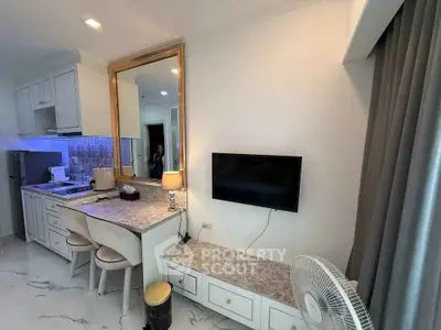 Chic modern living space with compact kitchen and stylish decor