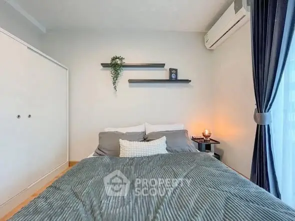 Cozy modern bedroom with stylish decor and natural light