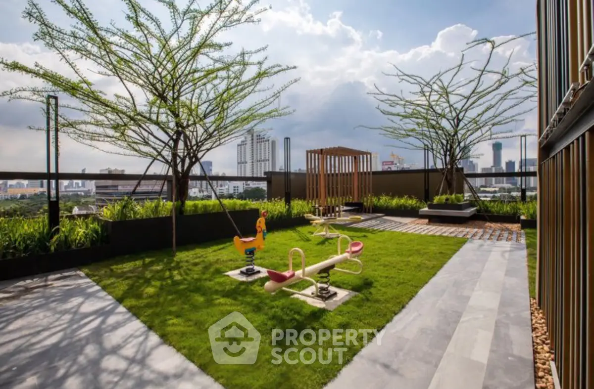 Stunning rooftop garden with city views and play area, perfect for relaxation and family fun.