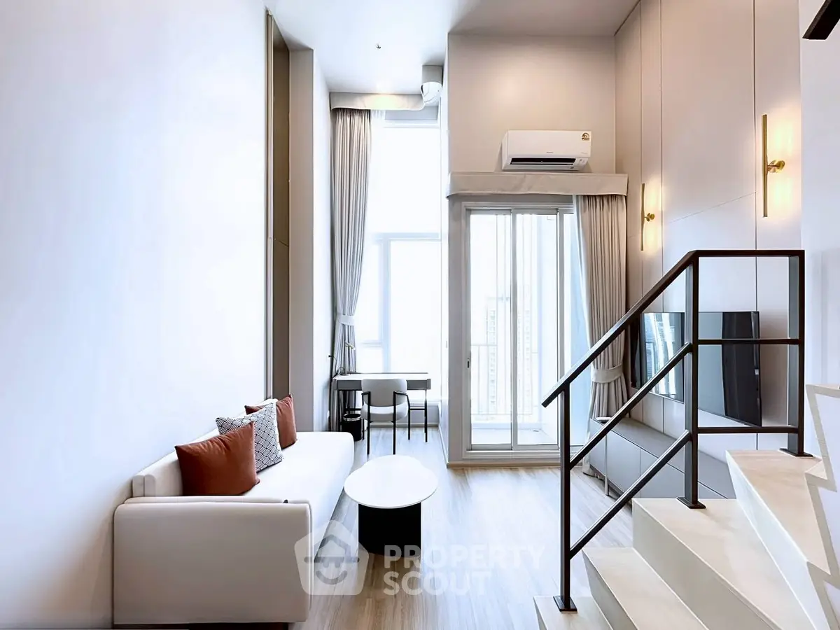 Modern duplex living room with high ceilings and stylish decor