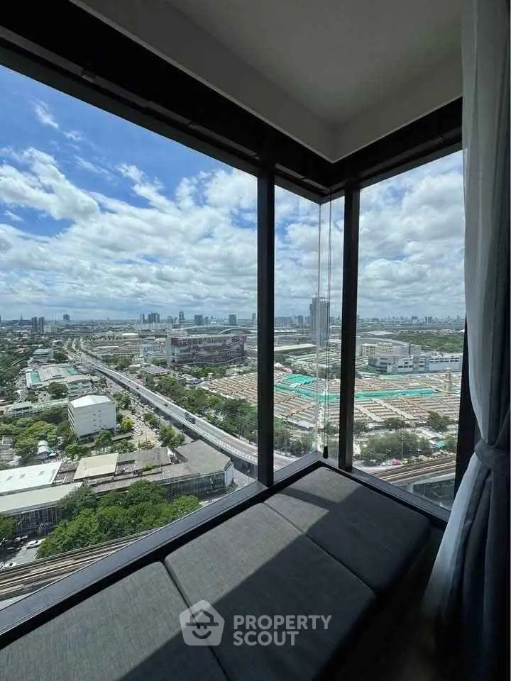 Stunning corner unit with panoramic city view from high-rise building.