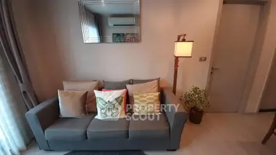 Cozy living room with stylish decor and comfortable seating in modern apartment.