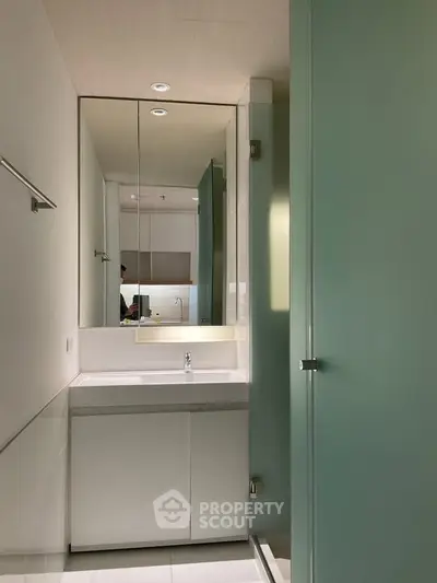 Modern bathroom with sleek design and glass shower enclosure
