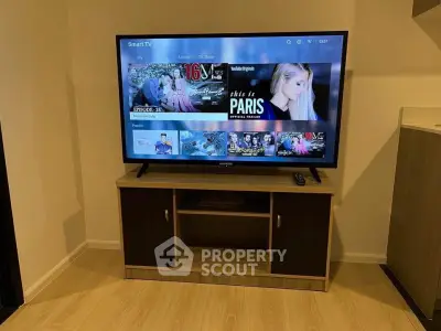 Modern living room with smart TV and stylish wooden cabinet