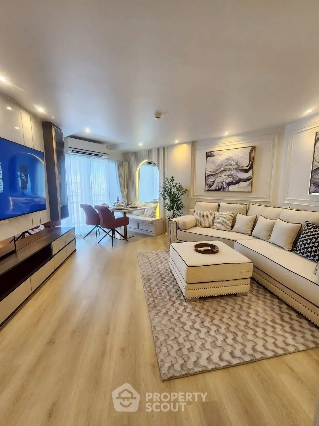 Luxurious living room with modern decor, spacious seating, and elegant lighting, perfect for relaxation and entertainment.