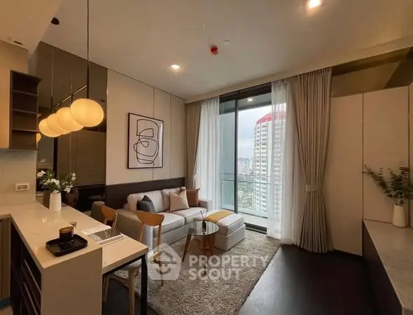 Modern living room with city view, stylish decor, and open layout in high-rise apartment.