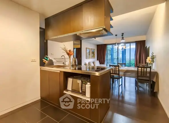 Modern open-layout kitchen with dining area and stylish decor