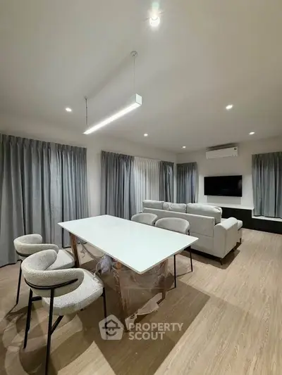 Modern living room with sleek furniture and ambient lighting