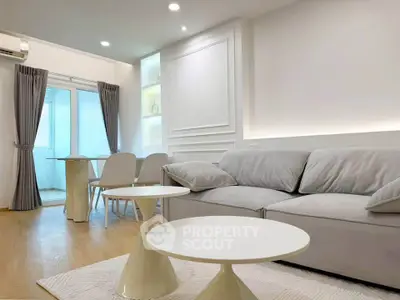 Modern living room with elegant decor and cozy seating area