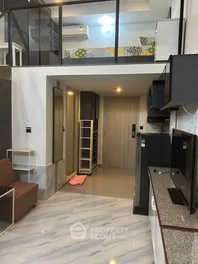 Modern loft apartment with sleek design and open layout, featuring stylish furniture and contemporary finishes.