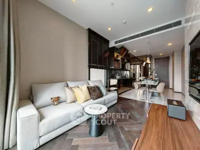 Modern living room with elegant decor and open kitchen layout