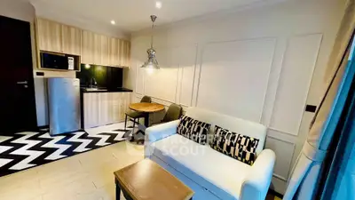Chic modern living room with stylish kitchen and cozy seating area
