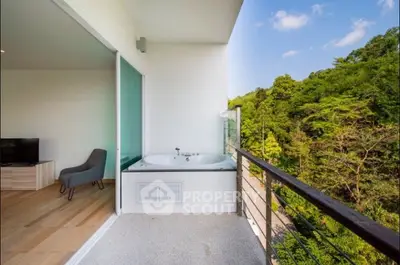 Luxurious balcony with outdoor bathtub and scenic forest view