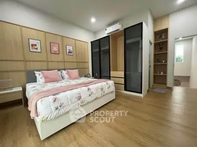 Spacious modern bedroom with elegant decor and ample storage space
