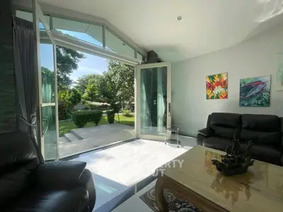 Spacious living room with garden view and modern decor
