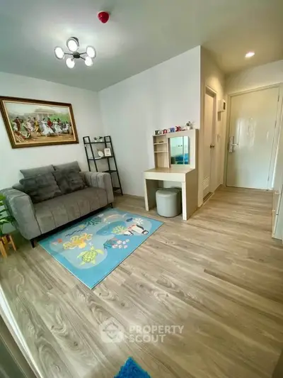 Charming living room with modern decor and cozy seating, perfect for relaxation and entertaining.