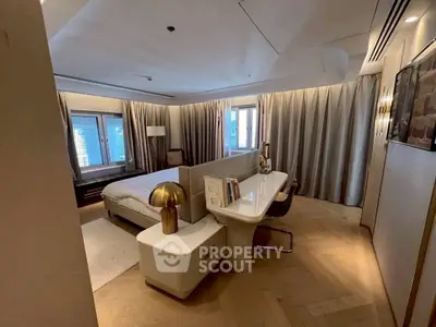 Luxurious bedroom with modern decor and city view, featuring elegant lighting and stylish furnishings.