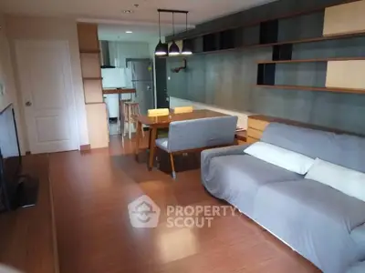 Modern living room with open kitchen and stylish furniture