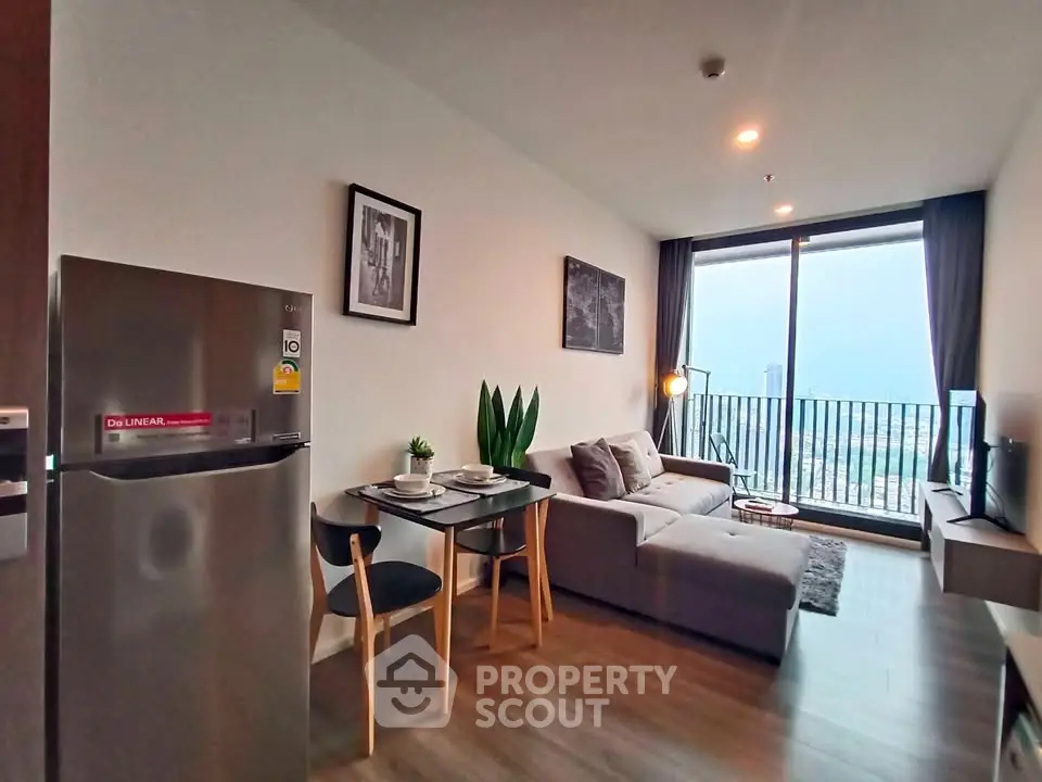 Modern living room with balcony view in high-rise apartment