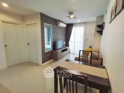 Modern living room with sleek furniture and natural light, perfect for cozy gatherings.