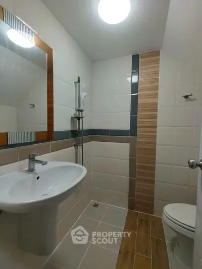Modern bathroom with sleek fixtures and stylish tile design