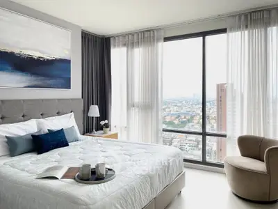 Luxurious bedroom with stunning city view and elegant decor
