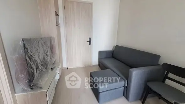 Cozy living room with modern gray sofa and TV setup