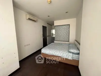 Spacious bedroom with modern air conditioning and stylish decor