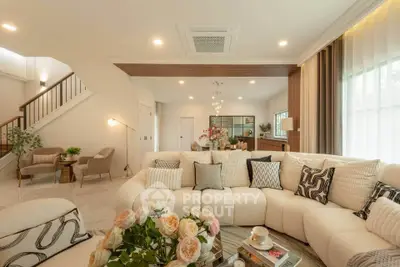 Luxurious open-plan living room with elegant decor and plush seating