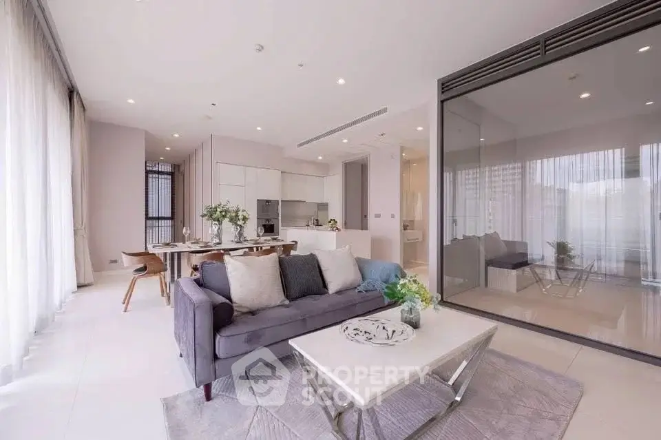 Spacious modern living room with open kitchen and elegant decor
