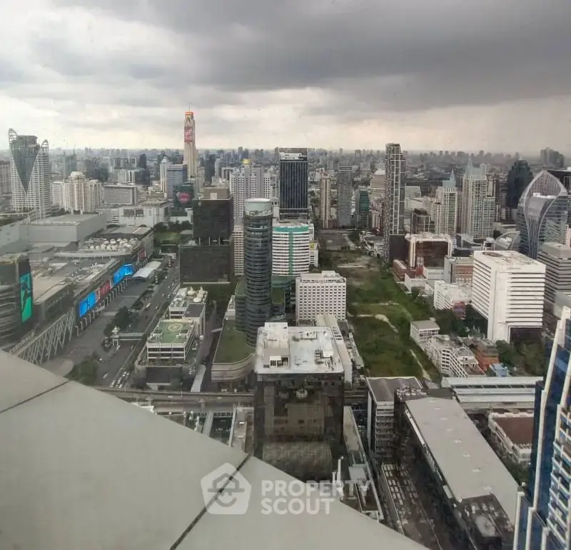 Stunning cityscape view from a high-rise building showcasing modern urban architecture and skyline.