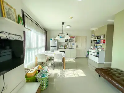 Spacious living room with modern decor and ample natural light