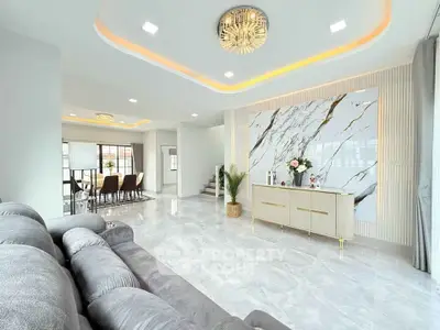 Luxurious modern living room with elegant marble accents and stylish lighting