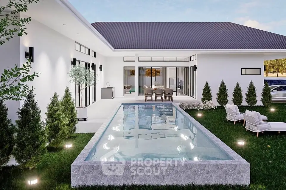 Modern luxury home with sleek pool and elegant outdoor seating area, perfect for entertaining.