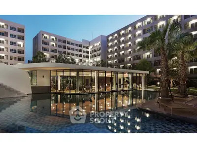 Luxurious modern apartment complex with stunning pool and evening lighting