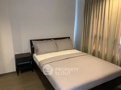 Cozy bedroom with modern furnishings and soft lighting, perfect for relaxation and comfort.