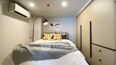 Cozy modern bedroom with stylish decor and ample storage space