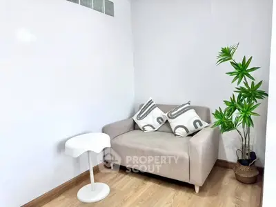 Cozy living room corner with modern sofa and stylish decor