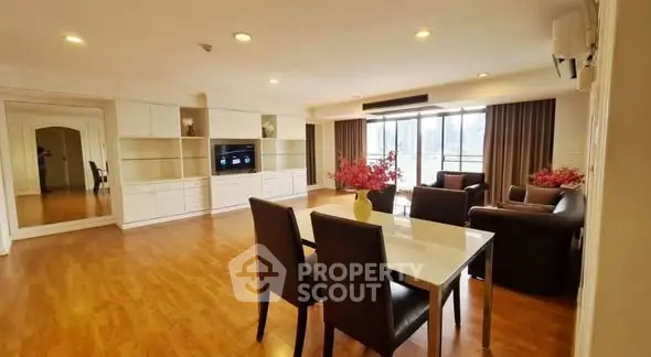 Spacious living room with modern furniture and large windows for natural light.